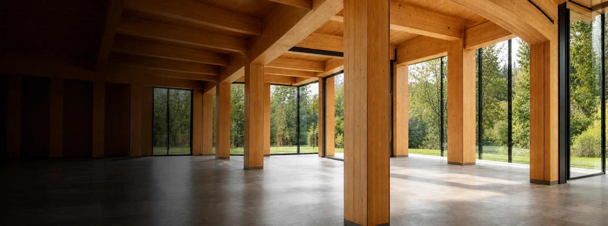 Exposed glue laminated timber columns and beams in a glazed architectural interior