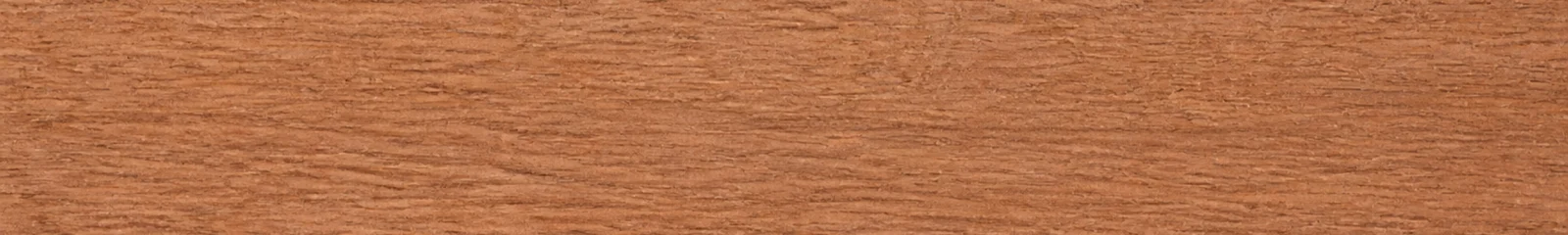 Close-up of reddish-brown Meranti timber with straight grain