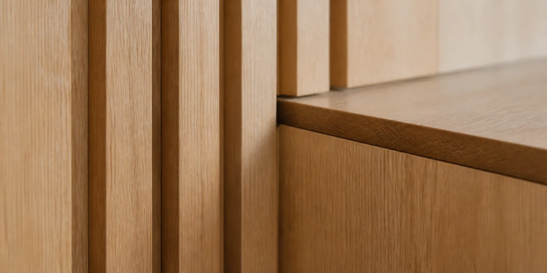 Precisely aligned vertical timber slats meeting a fitted wood ledge