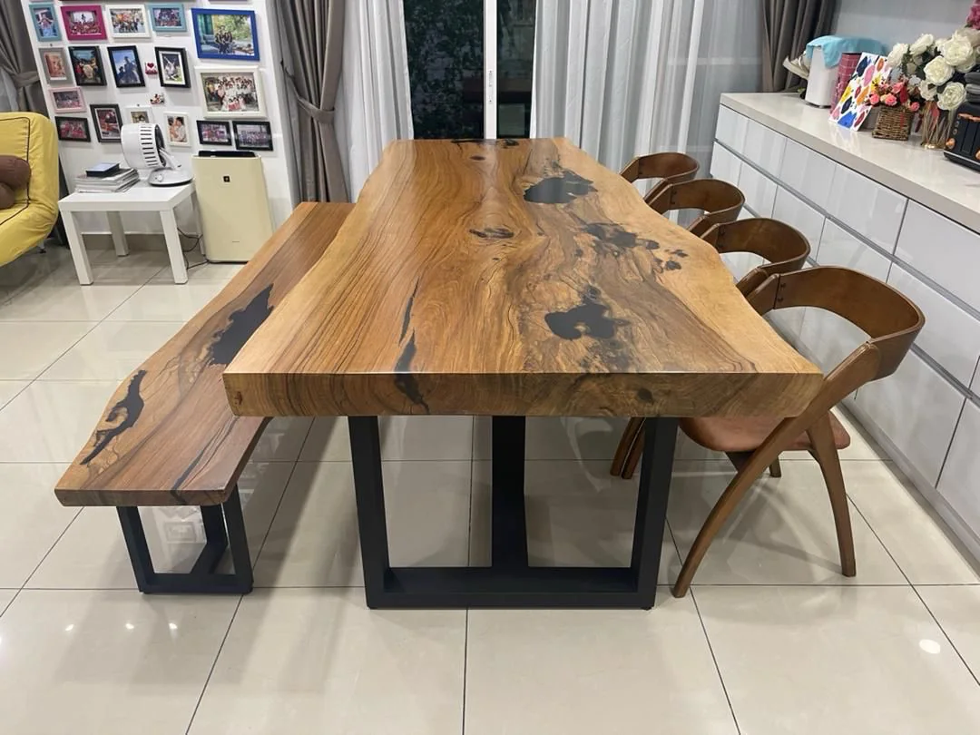 Eight-seater solid wood slab dining table with resin-filled natural features and matching bench